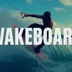 Rider wakeboard silhouette sur vague stylisée